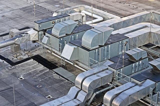 Air duct cleaning for commercial businesses on rooftop.